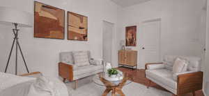 Sitting room featuring wood finished floors