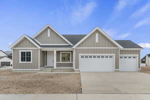 Farmhouse-style home with roof with shingles, a porch, 3-car garage, concrete driveway, and board and batten siding