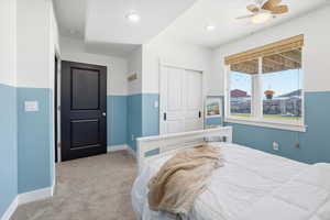 Carpeted bedroom featuring a closet, recessed lighting, and a ceiling fan