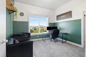 Office with carpet flooring and baseboards