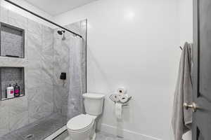 Full bathroom with a tile shower