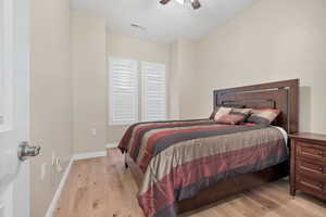 Bedroom with light wood-type flooring and ceiling fan