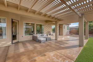 View of patio with a pergola and outdoor lounge area