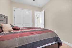 Bedroom featuring light wood-style flooring and a closet