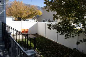 Fenced backyard with a mountain view