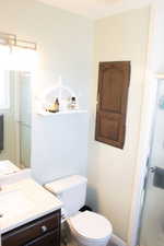 Bathroom featuring a stall shower and vanity