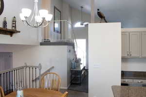 Dining space with a chandelier and light tile patterned floors