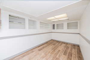 Spare room with light wood-style floors and baseboards