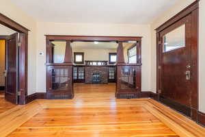 Foyer with wood-type flooring and a textured ceiling