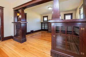 Unfurnished living room featuring light wood-style floors and a textured ceiling
