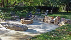 View of patio featuring an outdoor fire pit
