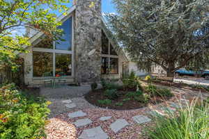Rear view of house with a chimney
