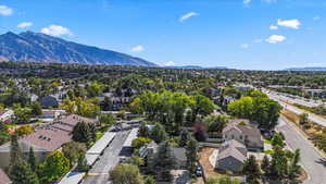 Aerial perspective of suburban area with a mountainous background