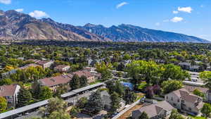 Aerial perspective of suburban area featuring a mountain backdrop