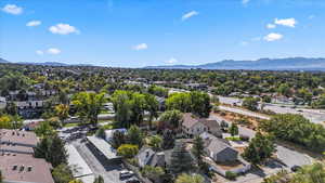 Aerial view of residential area featuring a mountainous background