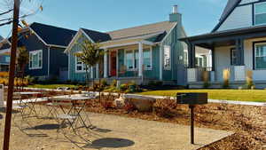 View of front of home and barbeque area