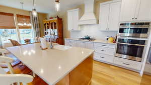 Kitchen with wall oven and microwave