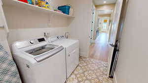 Laundry room featuring an added sink