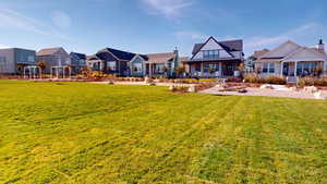 Front courtyard with park, swings, sitting area and barbeque