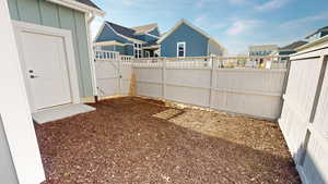 Fenced backyard with a gate