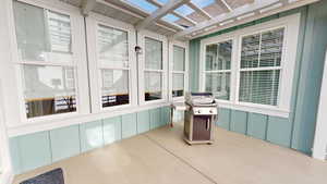 View of back patio and pergola style covering