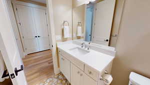 Bathroom with vanity and light wood finished floors