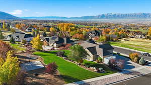 Aerial perspective of suburban area featuring a mountain backdrop