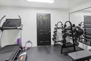 Exercise area with dark flooring