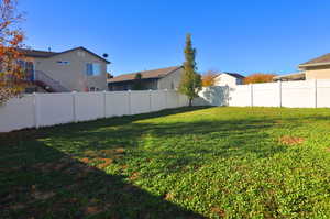 View of fenced backyard