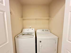 Washroom with washing machine and dryer