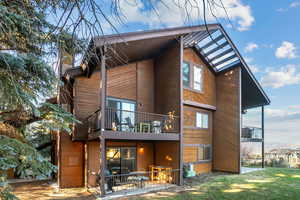 Rear view of property featuring a patio area