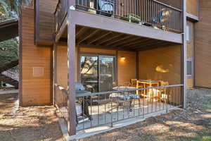 Patio / terrace featuring area for grilling, outdoor dining area, a deck, and stairs