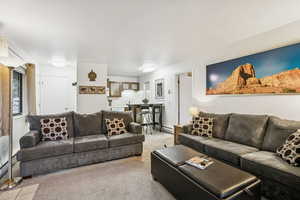 Living room with carpet floors and baseboards