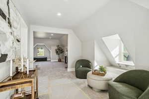 Bonus room featuring carpet floors, recessed lighting, and lofted ceiling