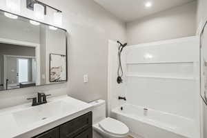 Bathroom with vanity and shower / bathtub combination