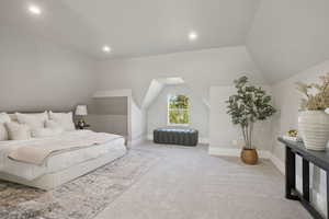 Bedroom with carpet flooring, lofted ceiling, and recessed lighting
