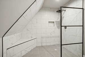 Bathroom with tiled shower