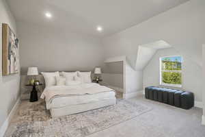 Bedroom featuring carpet, lofted ceiling, and recessed lighting