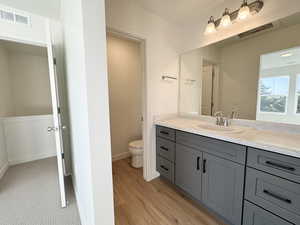 Bathroom featuring vanity and light wood-type flooring