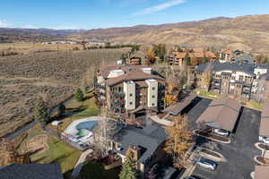 View of property location with mountains and a pool