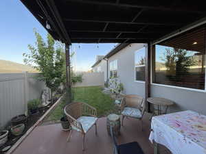 Fenced backyard with a patio