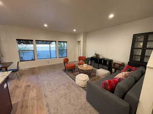 Living area featuring recessed lighting and light wood-style flooring