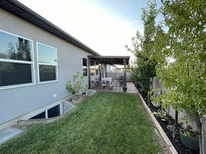 Fenced backyard featuring a patio