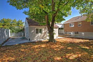 Rear view of property with a patio, a fenced backyard, a tiled roof, and stucco siding