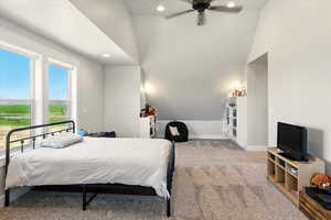 Bedroom featuring vaulted ceiling, light colored carpet, recessed lighting, and ceiling fan