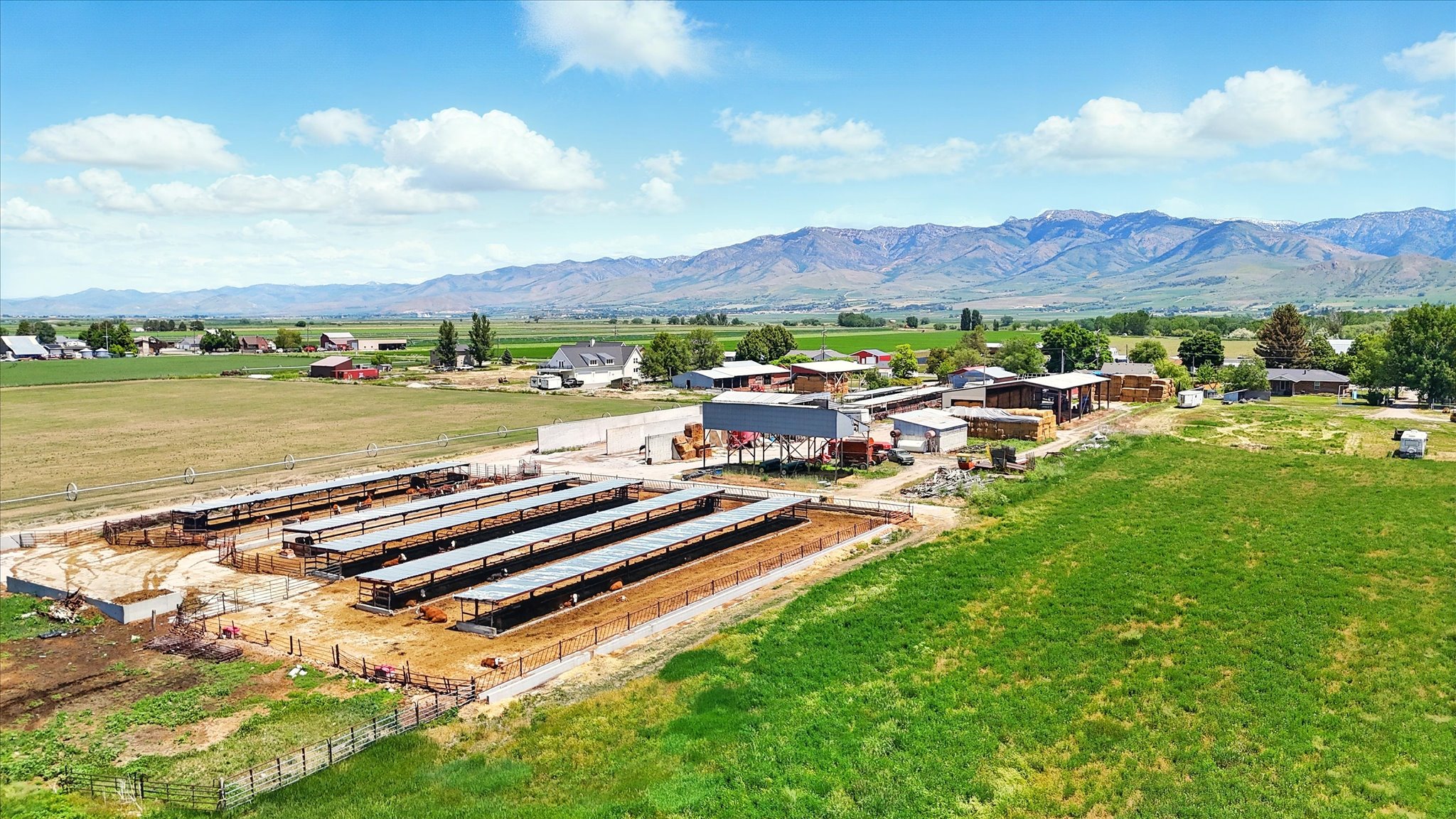Overview of corrals and barnyard featuring mountain views