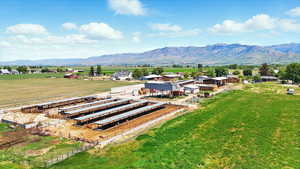 Overview of corrals and barnyard featuring mountain views