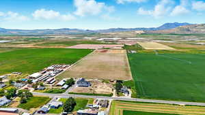 View of rural area featuring a mountainous background and abundant farmland