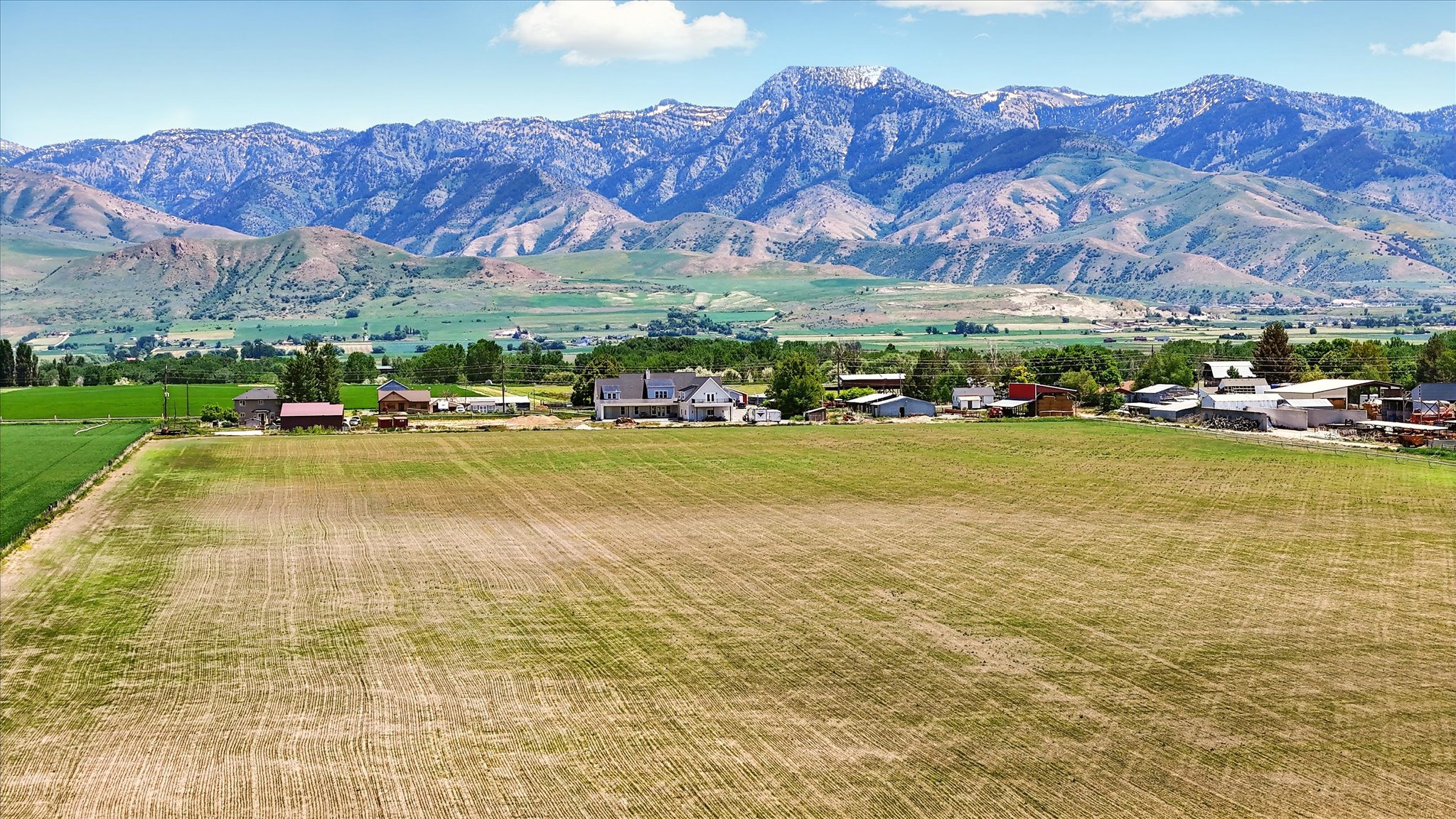 View of mountain background featuring rural landscape