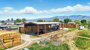 View of pole barn with a mountain view